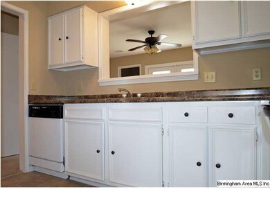 Kitchen cabinets are newly painted.