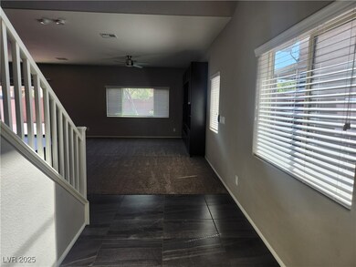 Hallway featuring plenty of natural light, dark co