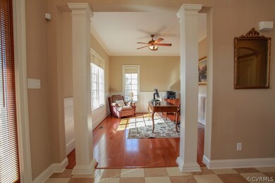 2-Story Foyer w/Travertine Flooring and 8' Wood Do