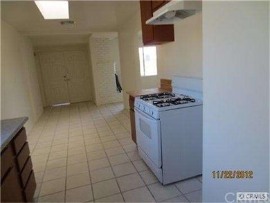 Another view of kitchen with new stove and cabinets