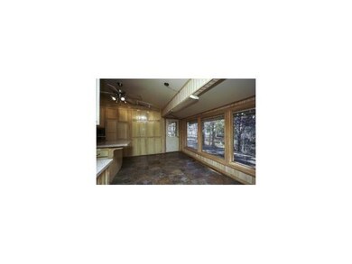 Kitchen. Breakfast Area with wall of windows and b