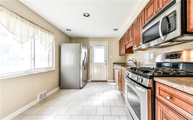 Sun drenched kitchen comes fully equipped with sta