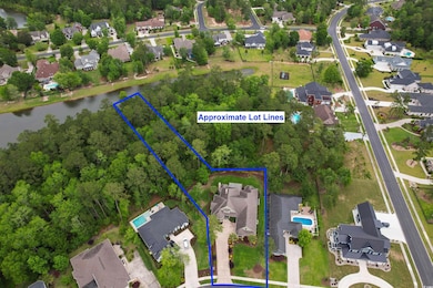 Drone / aerial view featuring a water view and a residential view