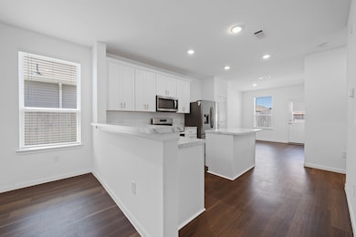 View of kitchen - second view. Stainless steel ref
