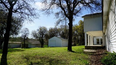 Back porch and yard with outbuildings