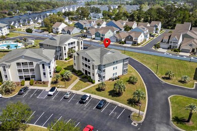 Aerial view featuring a water view and a residenti