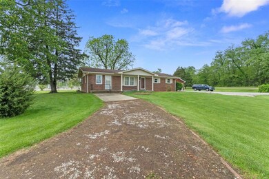 Exceptionally well maintained 1 story brick ranch on .73 acres