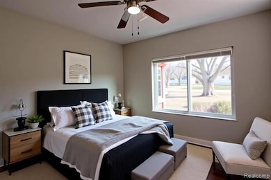 Bedroom featuring ceiling fan and wood finished floors