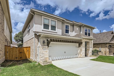 View of front of house with a garage, stucco sidi