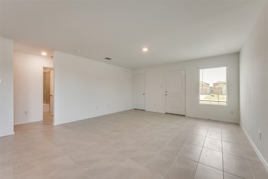 Spare room with light tile patterned floors and recessed lighting