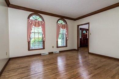 Formal Living Room with hardwood flooring, crown m