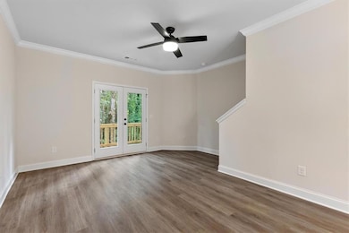 Unfurnished room with crown molding, hardwood / wo