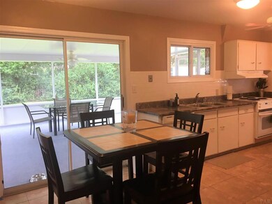 Overlooking the screen porch and backyard