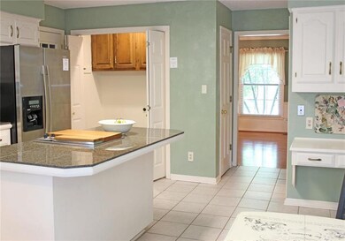Additional view of kitchen with access to laundry 
