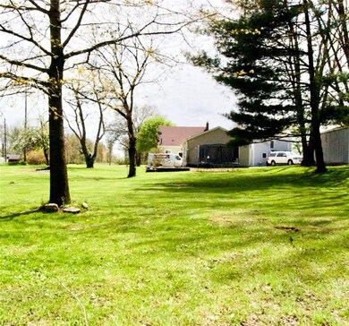 Backyard. Looking at the house from back edge of p