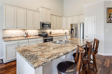 Upgraded kitchen cabinetry and gourmet kitchen isl