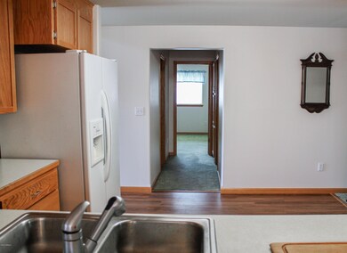 kitchen looking into laundry and bedroom