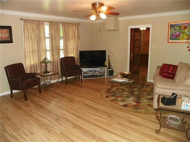 Living Room. Laminate wood floors, crown molding
