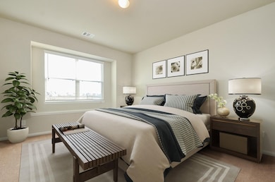 Primary Bedroom 
This photo has
been virtually staged to show the
potential of the home, and to help
show the scale of the furniture the
room can accommodate.