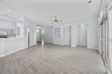 Unfurnished living room featuring light wood-style