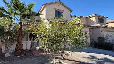 Mediterranean / spanish house with a garage, a tiled roof, stucco siding, concrete driveway, and a gate
