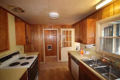 The kitchen, with wood cupboards...