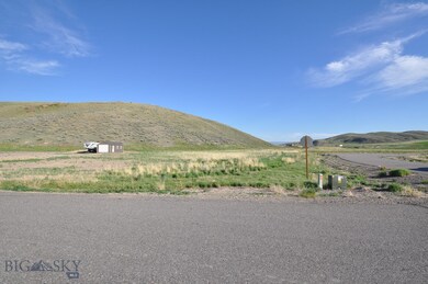 Wide angle view of the corner lot. Building is on