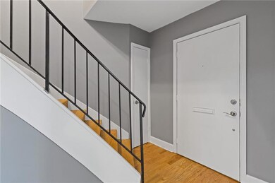 Foyer entrance featuring light wood-type flooring and stairs