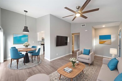 Living area with baseboards, ceiling fan, high va