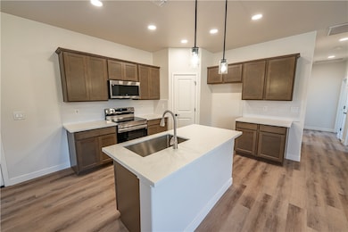 Kitchen featuring appliances with stainless steel