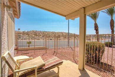 View of patio featuring fence