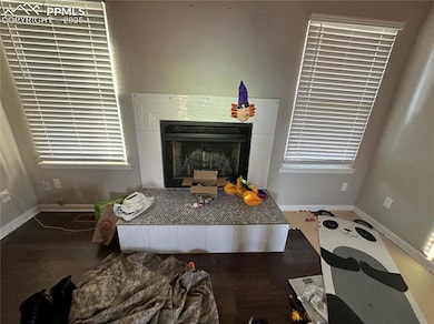 Room details with visible vents, a fireplace, and 