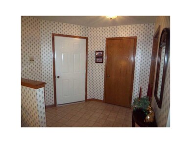 Entryway. Tiled entry with lighted walk-in coat cl