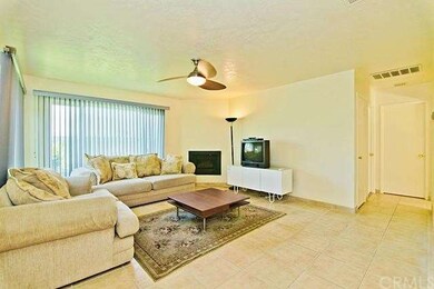 Newer tile floors and corner fireplace.