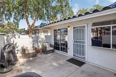 View of patio featuring fence