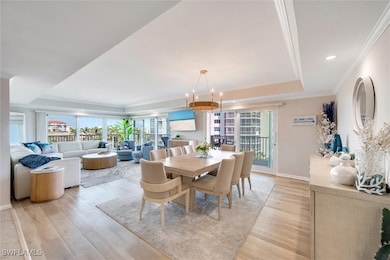 Dining room with baseboards, ornamental molding, l