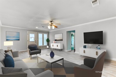 Living room with ceiling fan, light hardwood / woo