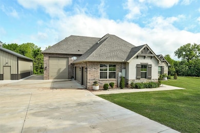 View of front facade featuring concrete driveway, 