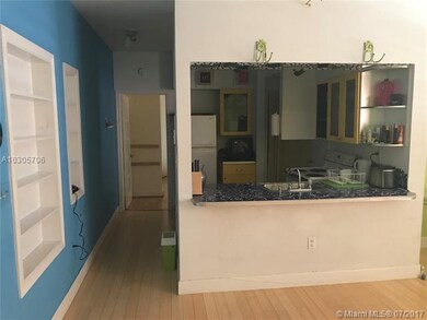 Kitchen & hallway to the room.