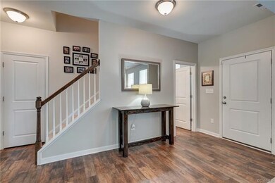 Generous Foyer is open to formal room.