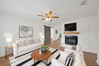 Updated open concept living room with fireplace