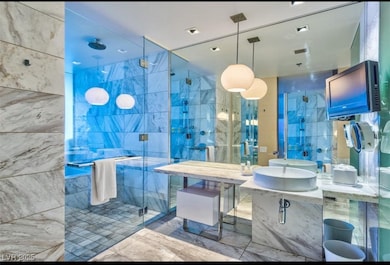 Full bathroom with visible vents, a stall shower,