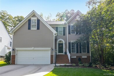 View of front facade featuring a garage