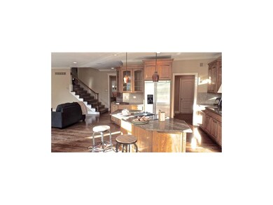 View of back staircase from kitchen