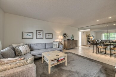 Living room with view of foyer and dining room