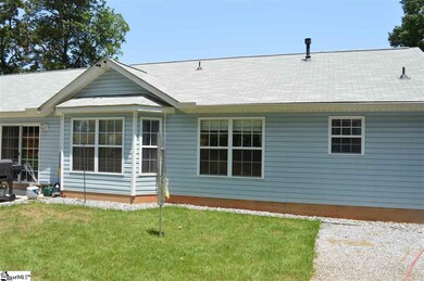 Back of House with rock bordering