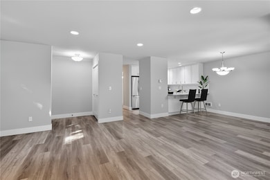 Brightly lit with recessed lighting throughout unit.