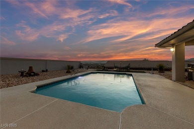 View of pool featuring a fenced backyard and a pat