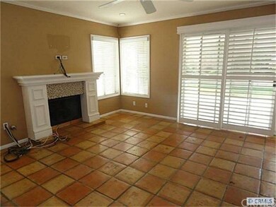 Family room is spacious with French sliders to pat