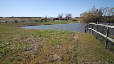 Property line follows the fence across the pond at
